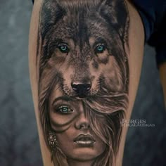 a woman with blue eyes and a wolf tattoo on her leg is featured in this photo