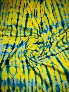 a yellow and blue tie dyed fabric