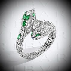 BVLGARI. ‘SERPENTI MISTERIOSI CHIMERA’ Watch - 18K white gold set with 4 marquise cut emeralds (3.24 carats) and 2 diamonds (2.00 carats), round brilliant cut diamonds (19.78 carats), 2 pear-shaped emeralds (0.60 carat) and 2 fancy cut emeralds (0.50 carat) eyes, 1 fancy cut sapphire (0.07 carat) nose #Bvlgari #Bvlgari2024 #AETERNABvlgari #Bvlgari140thBirthday #HighJewelry #Diamond #Serpenti Serpenti Bvlgari Necklace, Bvlgari Jewelry Serpent, Bulgari Serpenti Necklace, Bulgari Serpenti, Large Cuff Bracelet, Jewelry Sapphire, Bvlgari Serpenti, Pink Garnet