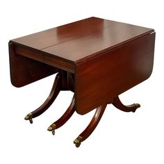 a wooden desk with two brass legs