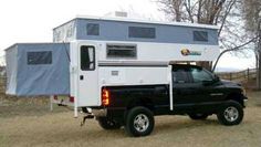 a truck with a camper attached to the back