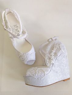 "White embellished lace wedding wedge sandals for bride. Outdoor weddings or beach elopements, these wedge shoes keep you comfortable all night long! White lace sandals compliment your boho bridal look beautifully. White bridal wedge shoes are designed with embroidered lace. Glass beads, luminous sequins and small pearls are used on the embroidery. Buckle straps keep your foot secure. Custom details can be added on this design, custom heights available. They are made of soft vegan leather and de Elegant Open Toe Wedge Sandals For Wedding, Wedding Open Toe Wedge Sandals With Removable Insole, White Wedge Heel Sandals For Wedding, White Wedge Sandals For Wedding, Open Toe Wedge Sandals With Removable Insole For Wedding, Elegant White Wedge Sandals For Wedding, Summer Wedding Wedge Sandals With Removable Insole, White Wedge Heel Heels For Wedding, White Wedge Heel Wedding Shoes