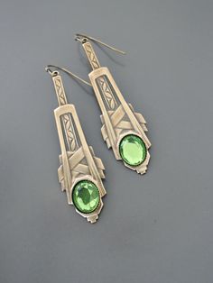 "Vintage Jewelry - Art Deco Inspired Earrings - Crystal Earrings - Bridal Earrings - Gold Earrings - Green Earrings - handmade Jewelry So gorgeous! Awesome Art Deco inspired earrings embellished with three sparkling green vintage crystals. Gold plated. Would be perfect for your wedding. Chloe says, \"Wear them and feel fabulous!\" They measure just over 2 1/2\" long. Thanks for visiting Chloe's" Handmade Art Deco Jewelry For Anniversary, Formal Green Nickel-free Earrings, Art Nouveau Dangle Earrings For Gifts, Art Nouveau Dangle Earrings Gift, Handmade Art Deco Silver Earrings, Handmade Silver Art Deco Earrings, Art Deco Jewelry With Matching Earrings As Gift, Art Deco Jewelry With Matching Earrings For Gifts, Handmade Sterling Silver Art Deco Earrings