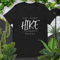 "Oh, this is the right one for you, if you feel like \"Eat Sleep Hike Repeat Tshirt\" best describes your way of surviving adventures and exploration of life, what you can do with this Id hike that t shirt. Take a hike tee is a great thru hiker gift or one of the best explorer gifts. You can easily use it as a hike shirt or camp tshirt bachlorette! And go with your adventure friend into the forest, 52 hikes or up with the mountains with this go hiking shirt for him or use it as multiple hiker gifts for her. PHILOSOPHY We are passionate about nature and everything connected to outdoors! We desire to be in wilderness, to go for a hike, walk, trek, ski, raft, climb, camp etc. Our designs are made to remind us the place where we truly belong - nature (our true habitat)!  So, if you have feelin Funny Text Short Sleeve T-shirt For Outdoor, Black Hiking T-shirt With Letter Print, Black Letter Print T-shirt For Hiking, Black T-shirt For Hiking With Letter Print, Wilderness Explorer, Hiker Gifts, Hiking Tshirt, Into The Forest, Hiking Shirt