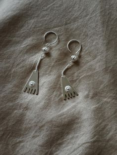 This is one of unique silver jewelry made by YI people.  Each piece are all hand made  We have 5 in stocks from July 2024.  When it sold out, next restock will be in 30days. Let me know if you like the style or anything you want to talk about it. Very much appreciated you like us. Handmade Symbolic Silver Earrings, Silver Handmade Symbolic Earrings, Symbolic Handmade Silver Earrings, Sterling Silver Earrings With Unique Design, Unique Silver Jewelry, Hand Shapes, Silver Earrings, Jewelry Earrings Dangle, Silver Jewelry