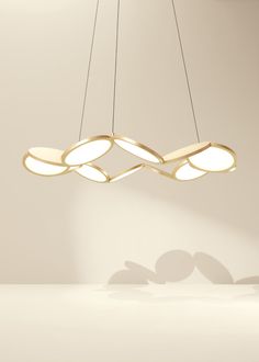 a modern light fixture hanging from the ceiling