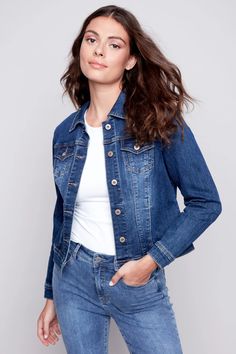 Charlies B's Denim Jean Jacket is a classic denim jacket style with brass hardware and a tailored look. Made in a stretchy cotton jean fabric that is soft and comfortable. A perfect go-to topper for just about any outfit! Updated cropped length falls just over waist on most. Vintage wash indigo. Two front chest pockets and two side pockets.Made in ChinaFabric: 73% Cotton, 23% Polyester, 3% Viscose, 1% SpandexCare: Wash Gentle, Hang to DrySize Medium (M): Bust 38", Hip 38", Length 21" Dark Wash Fitted Denim Jacket For Everyday, Classic Fitted Dark Wash Denim Jacket, Fitted Dark Wash Denim Jacket, Everyday Fitted Dark Wash Denim Jacket, Fitted Dark Wash Denim Jacket For Everyday, Classic Fitted Medium Wash Denim Jacket, Everyday Fitted Medium Wash Denim Jacket, Everyday Fitted Denim Blue Jacket, Fitted Denim Jacket In Dark Wash With Button Closure