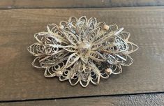 "Vintage Sterling 925 Filagree Brooch Excellent condition Measures: L = 2\" W = 1 1/2\"" Silver Filigree Brooch For Anniversary, Silver Filigree Brooch For Formal Occasions, Formal Silver Filigree Brooches, Silver Filigree Brooches For Collectors, Collectible Silver Filigree Brooches, Ornate Filigree Brooches For Collectors, Ornate Sterling Silver Filigree Brooches, Elegant Silver Brooches Stamped 925, Ornate Silver Brooch With Intricate Design