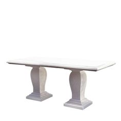 a white marble table with two pedestals on each side and one column at the end