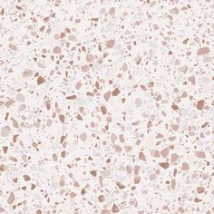 a white and brown speckled background with lots of small dots on the top of it