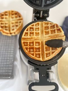 two waffles are being cooked on a griddle