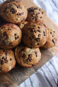 chocolate chip muffins stacked on top of each other with text overlay that reads sourdough banana chocolate chip muffins