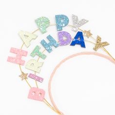 a birthday headband with glitter letters and stars