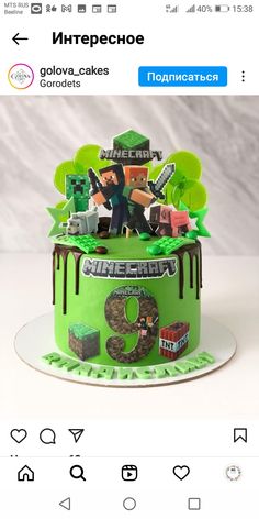 the cake is decorated with legos and green frosting, which reads minecraft