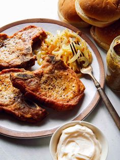 the meal is prepared and ready to be eaten on the table, including burgers