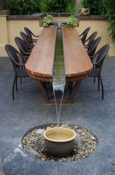 a wooden table with water coming out of it