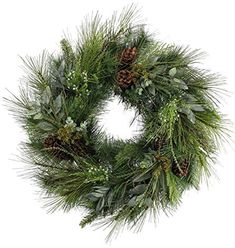 a christmas wreath with pine cones and greenery