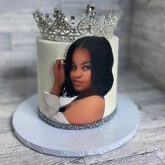 a cake with a photo of a woman wearing a tiara on top of it