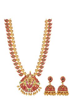 Gold toned brass necklace with carved temple motifs, stone embellishments and bead drops. Comes with jhumkis.
Components: Necklace, Pair of earrings
Type: Stone and Beads
Composition: Brass
Color: Gold
Dimensions L x B (cms):
Necklace: 36 x 7
Earrings: 4 x 1
Weight (gms): 135
Closure:
Earrings: Push back clasp
Note: Bangles worn by the model are not for sale - Aza Fashions Temple Jewelry Style Necklace With Latkans For Celebration, Temple Jewelry Necklace With Latkans For Celebrations, Temple Necklace With Latkans For Celebration, Temple Jewelry Sets With Latkans For Rituals, Temple Jewelry Necklace With Stone Work For Celebration, Festive Temple Necklace With Stone Work For Rituals, Multicolor Temple Necklace For Rituals, Navratri Temple Jewelry Necklace With Stone Work, Ceremonial Temple Necklace With Stone Work