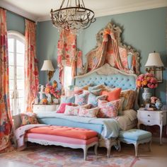 a bedroom with blue walls, pink and orange bedding, chandelier and curtains