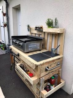 an outdoor kitchen made out of pallet wood