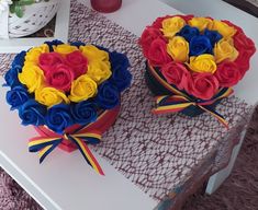 two cakes decorated with flowers on a table