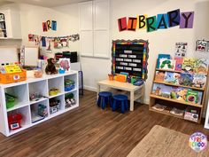 a child's playroom with toys and books on the shelves in front of it