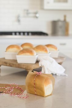 bread rolls sitting on top of a counter next to paper towels and candy canes