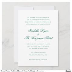 an elegant wedding card with the wording in black and white, on a marble surface