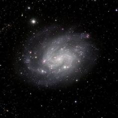 an image of a spiral galaxy in the sky