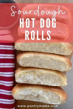 four hot dogs on buns with ketchup in the background and text overlay that reads sourdough hot dog rolls