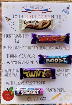 a hand holding up a piece of paper with candy on it and the words thank you written