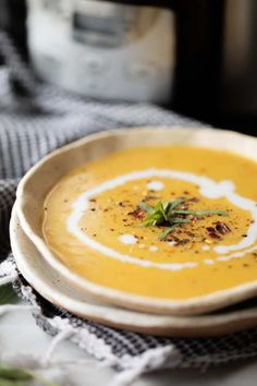 a white bowl filled with soup on top of a table