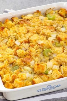 a casserole dish filled with stuffing and vegetables