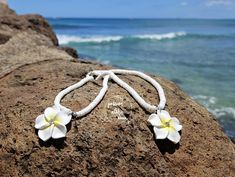 Aloha, beach lovers! 🌺 Dive into island magic with our Plumeria seashell necklace! Inspired by the vibrant beauty of the Hawaiian Islands, this charming accessory brightens up your everyday outfits, whether you're lounging by the waves or enjoying a sunset cocktail. Imagine wearing a stunning, handmade plumeria blossom that sparkles like sunlight on the ocean. Each flower is crafted with care, making every necklace uniquely yours! With whimsical seashell beads, this piece captures the essence of paradise and is sure to invite compliments wherever you go. Elevate your accessory collection with our Plumeria seashell necklace and let the spirit of the islands shine through in your everyday style! 🌟 Special Offer: Enjoy our BUY MORE, SAVE MORE ON SHIPPING deal! 😄 Please note that colors may Sunset Cocktail, Necklace Seashell, Hawaiian Necklace, Hawaiian Jewelry, On The Ocean, Seashell Jewelry, Seashell Necklace, Hawaiian Islands, Beach Lovers