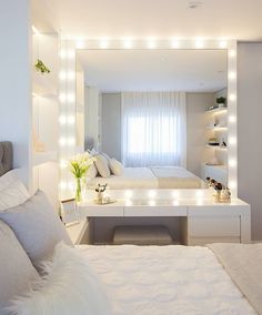 the instagram page shows an image of a bedroom with white furniture and bright lights