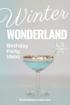 a blue cocktail in a martini glass with the words winter wonderland birthday party ideas