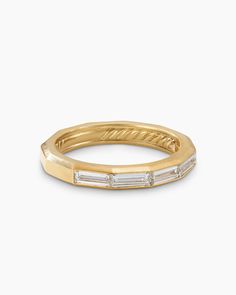 a yellow gold band with baguets and diamonds