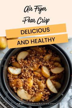 a bowl filled with apples and granola on top of a table next to an apple