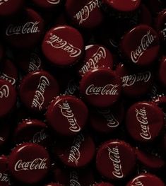 coca - cola bottle caps are shown in close up