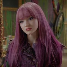 a close up of a mannequin head with long pink hair and purple wig