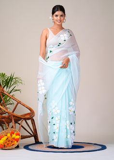 Introducing our exquisite Teal Base Chiffon Saree, a masterpiece hand-painted with delicate white dogwood flowers that exude elegance and charm. This Women's Chiffon Saree is a true work of art, perfect for various occasions and celebrations, whether it's a party, wedding, or any special event. The saree boasts a captivating teal color as its base, creating a striking contrast against the pristine white dogwood flowers that adorn its entire length. The hand-painted design adds a unique touch, ma Semi-stitched Organza Blouse Piece For Puja, Organza Blouse Piece With Cutdana For Puja, Organza Blouse Piece With Pallu For Puja, Organza Saree With Resham Embroidery For Puja, Organza Blouse Piece For Diwali Puja, Organza Saree For Puja, Unstitched Organza Saree For Puja, Organza Blouse Piece With Traditional Drape For Puja, Organza Saree With Zari Work For Puja