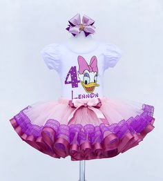 I offer you a beautiful birthday tutu outfit girl. NOTES FOR THE SELLER -Number for personalizing the top. -Name to personalize the vertex. -Need by date. Sleeve for the top - short, long. TOP. The top of it is 100% cotton. Size 3-24 months it is a bodysuit, 2T-10T it is a shirt. (Since it is more handmade always remember the shirt needs to be washed inside out, hand washed and air dried). SKIRT - made of soft tulle, edged at the bottom with a ribbon and decorated with a bow. Tutu is planted on Easter Birthday Ruffled Tutu Dress, White Sweet Tutu Dress For Birthday, Sweet White Tutu Dress For Birthday, Purple Summer Tutu Dress For First Birthday, Purple Tutu Dress For First Birthday In Summer, Spring Princess Tutu Dress For Birthday, Fitted Ruffle Tutu Dress For Birthday, Princess Style Tutu Dress For Birthday In Spring, Fitted Ruffled Tutu Dress For Birthday