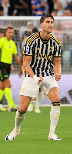 a man standing on top of a soccer field