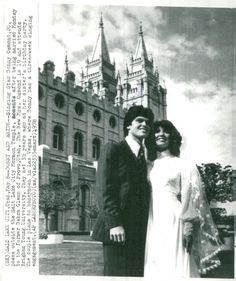 an old black and white photo of two people in front of a castle