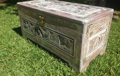 an old chest sitting in the grass