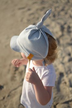 "Accessorize baby boy's or baby girl's outfit with a summer headscarf. Linen and cotton summer headscarf is created for all the little boys and girls. The hat is tied up on the back so you can leave it looser or tighten as much as you wish. Also You can tie up the knot on the top higher or lower and adjusted to the optimum size. As a result this summer hat is sustainable for a very long time. Sizes of the headscarf are according the circumference of the head or age. To measure the head of the ch Summer Cotton Hat For Play, Cotton Sun Hat With Uv Protection For Playtime, Adjustable Cotton Sun Hat For Playtime, Casual Beach Bonnet Cap, Summer Cotton Sun Hat For Playtime, Cotton Playtime Hats With Uv Protection, Cotton Curved Brim Sun Hat For Playtime, Playful Cotton Hat With Upf 50+, Playful Cotton Hats With Upf 50+