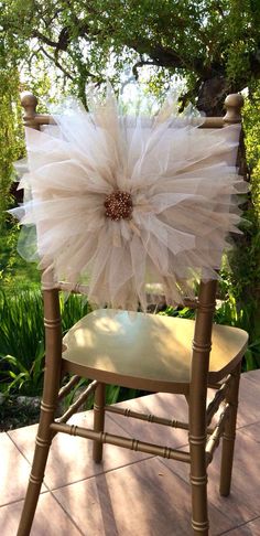 a chair with a flower on the back