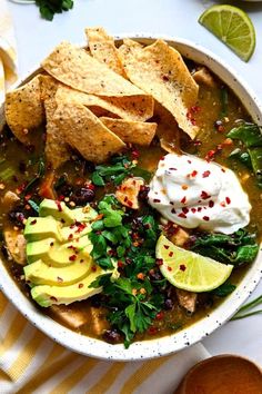 a white bowl filled with chicken tortilla soup