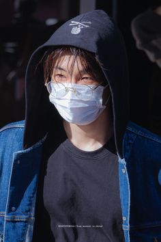 a person wearing a face mask and jacket